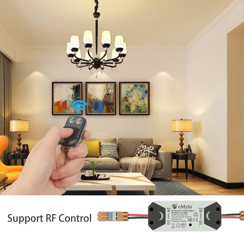 Hand holding the eMylo remote control, with a light fixture in the background, demonstrating RF control.