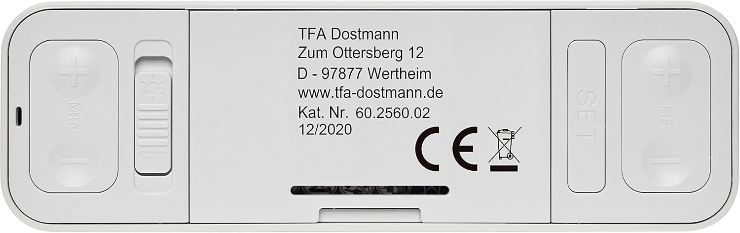 Bottom view of the TFA Dostmann Twist Radio-Controlled Alarm Clock showing battery compartment and control buttons.