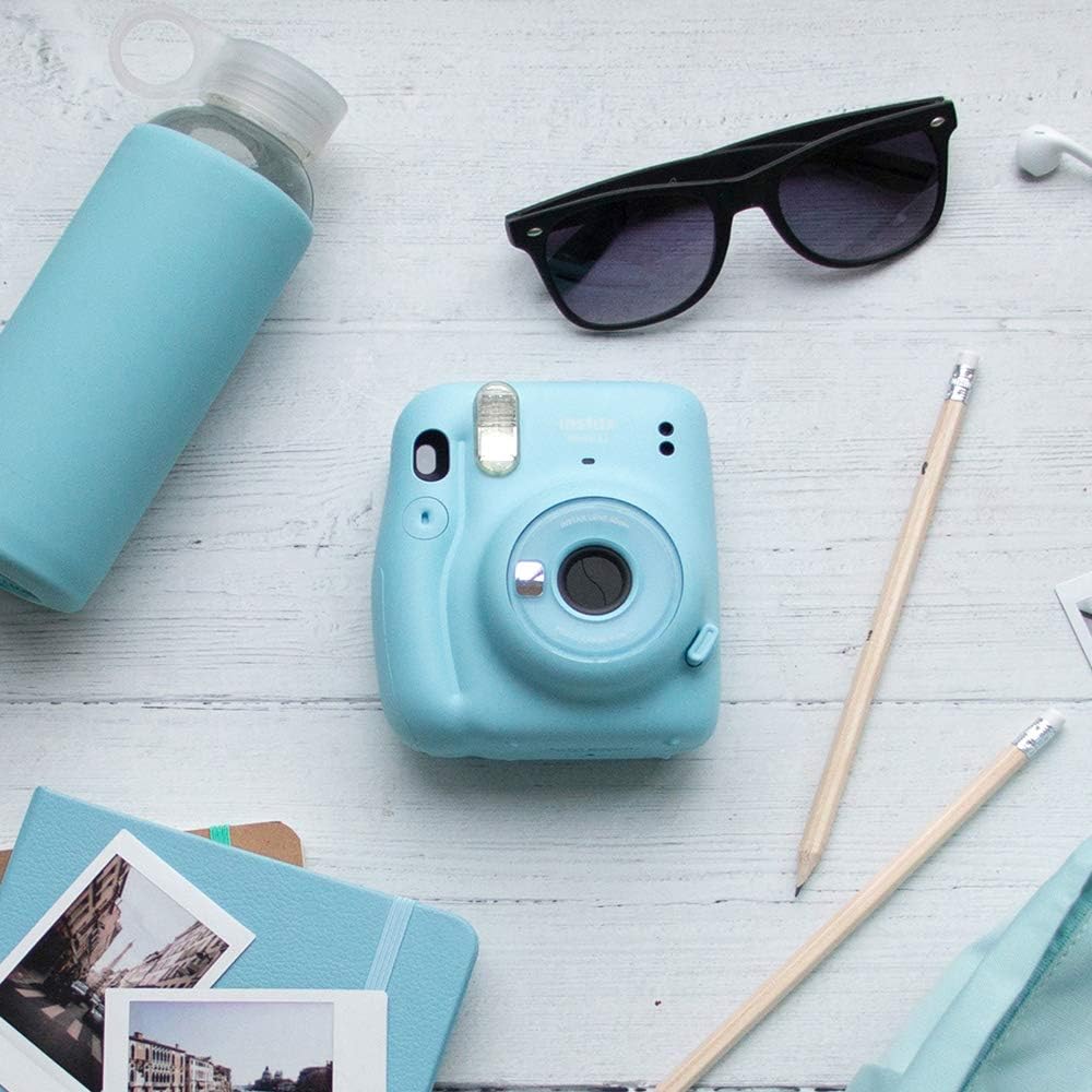 Front view of the Instax Mini 11 camera, showing the lens extended and the flash unit.