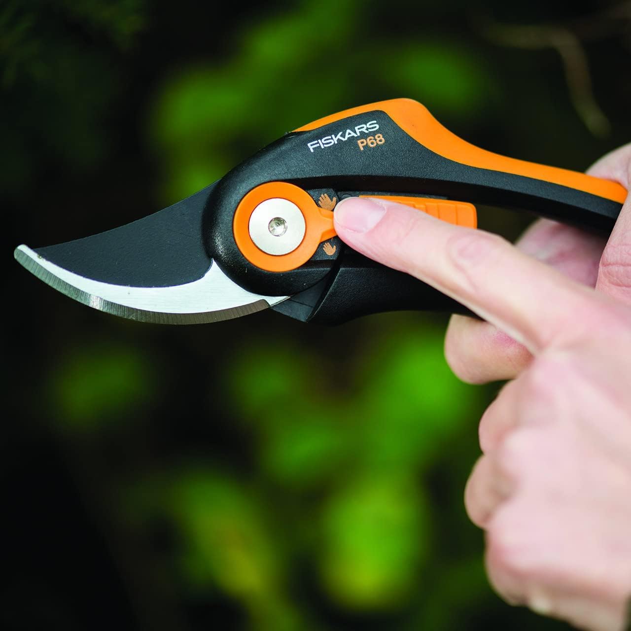 Hand adjusting dial on Fiskars pruner