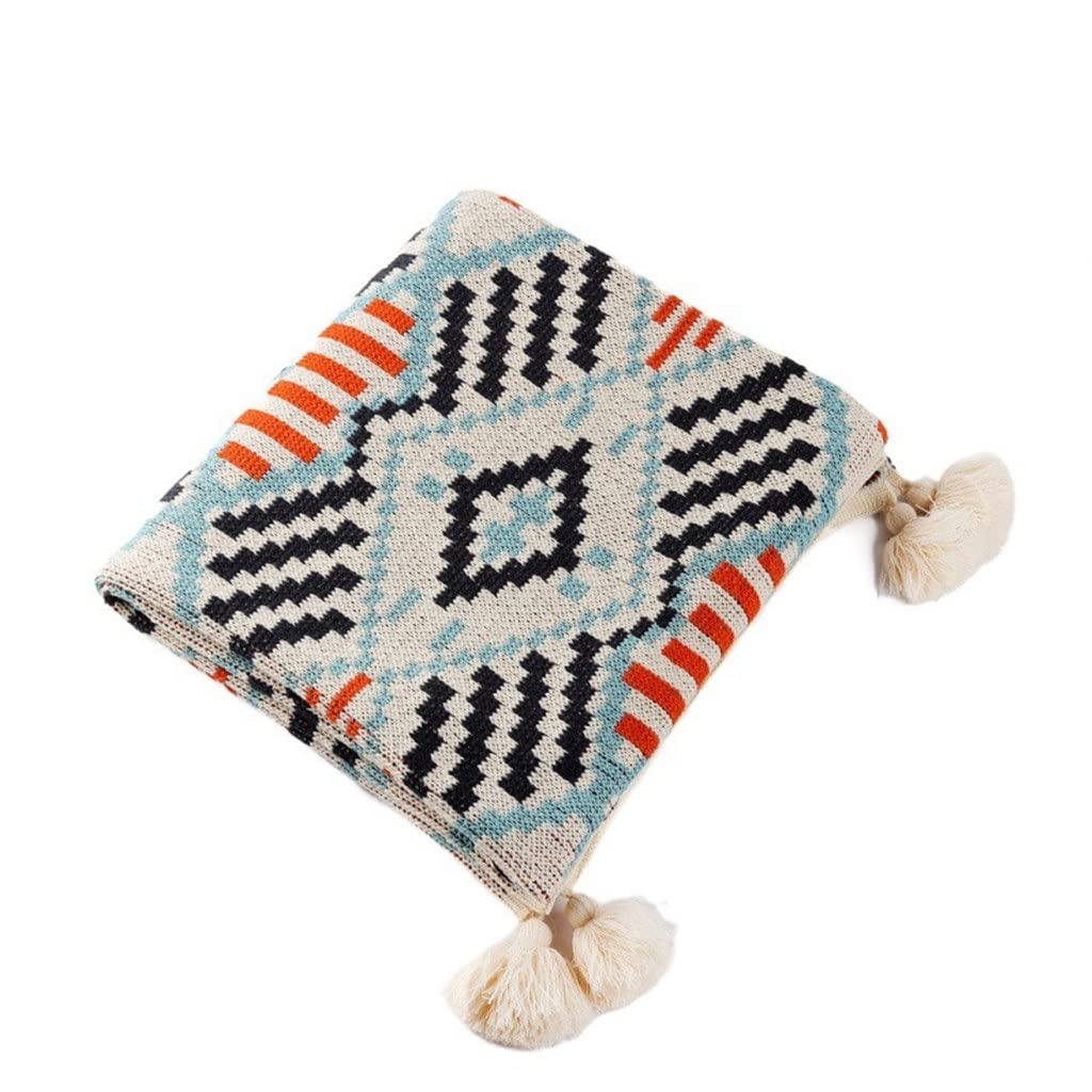 Couverture tricot géométrique boho avec finitions à gland pour un intérieur élégant et raffiné