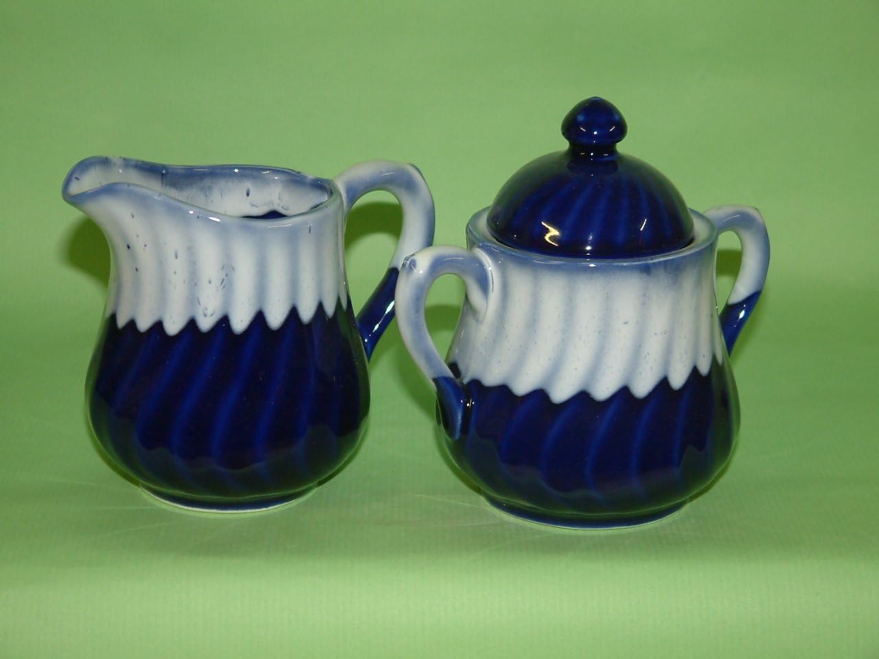 Pottery cream and sugar set in cobalt blue with white glaze rims.will match our