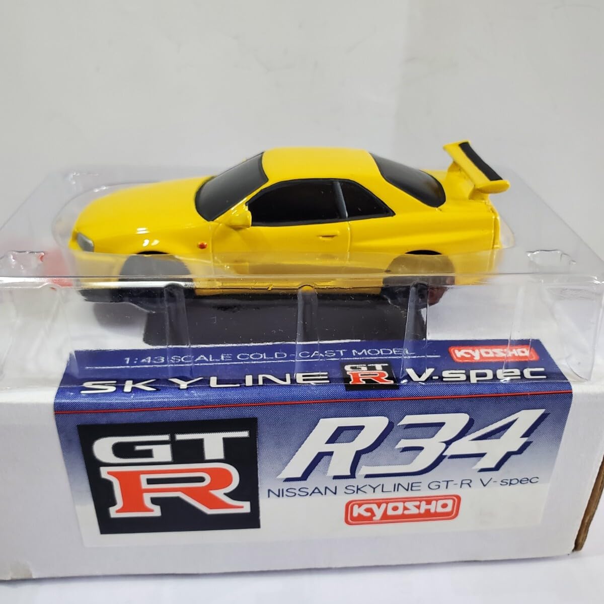 Amazon | 京商 1/43 「限定生産 SKYLINE R34 GT-R V-SPEC」黄色