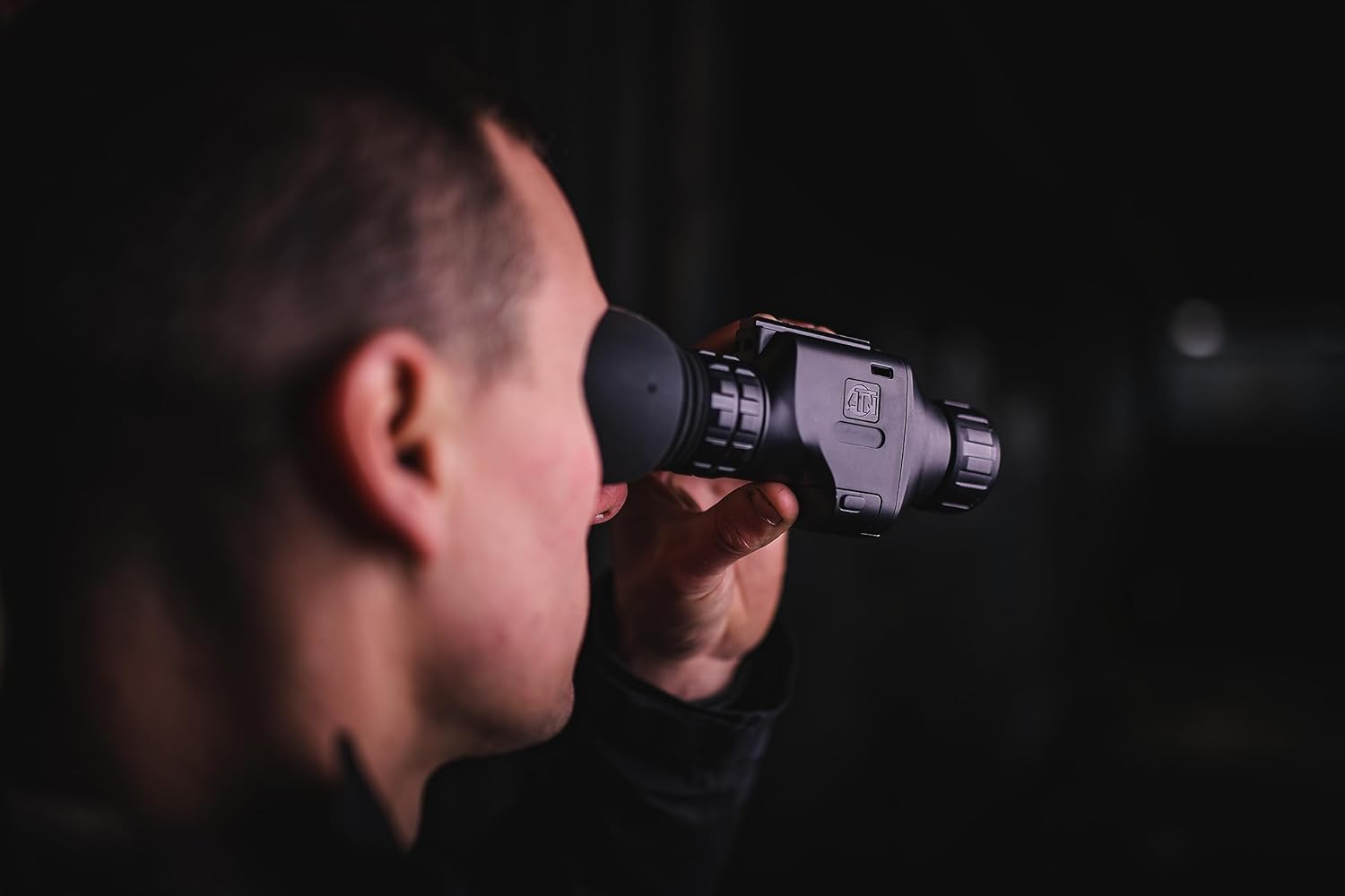 Close-up of a person using the ATN Odin LT Thermal Monocular, held up to their eye
