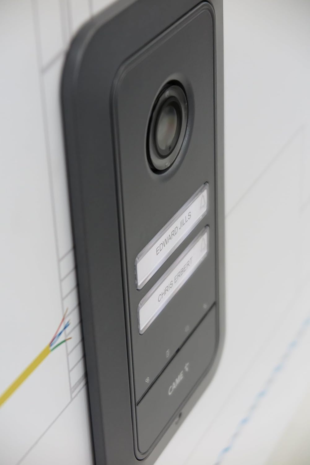 Man interacting with the CAME BPT PLX V indoor video monitor