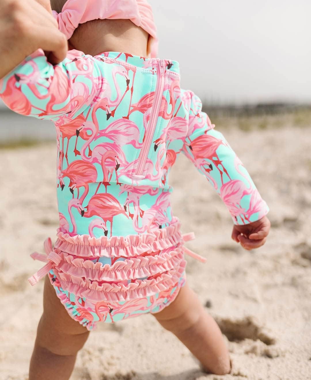 RuffleButts Baby Girls UPF 50+ Sun Protection Tropical Print Long Sleeve One Piece Rash Guard Swimsuit with Zipper - Fab Flamingo X, 3-6m - Image 3