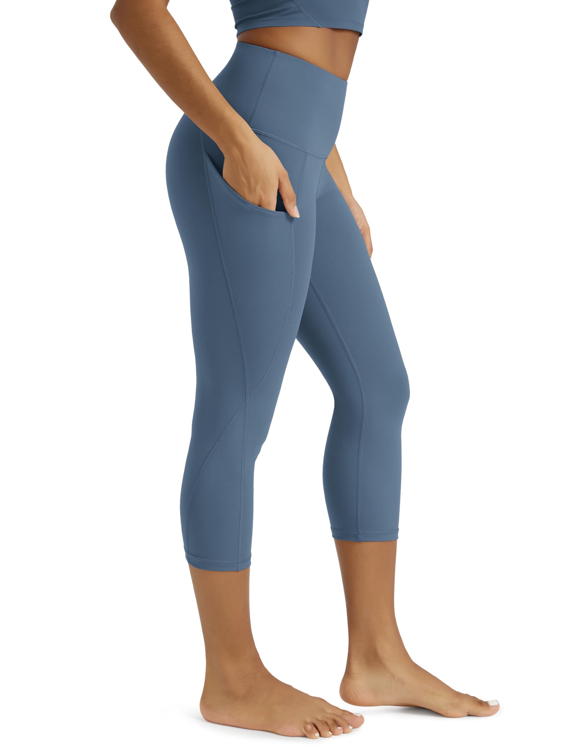 ODODOS Women's High Waisted Yoga Capris with Pockets, Tummy Control Non See Through Workout Athletic Running Capri Leggings