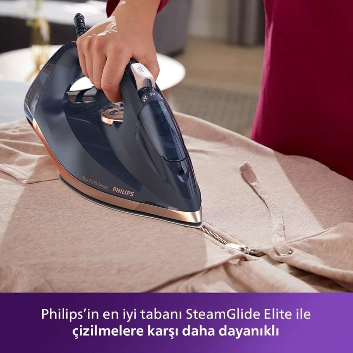 Person ironing a garment with Philips Azur DST7510/80 Steam Iron