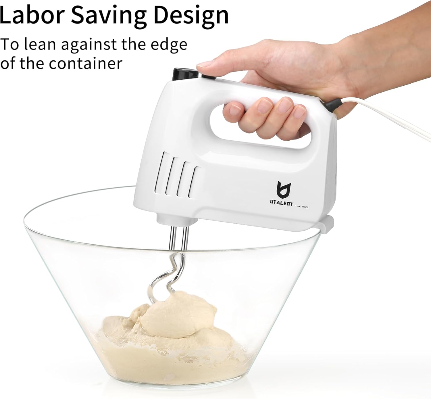 Hand mixer leaning on the edge of a mixing bowl