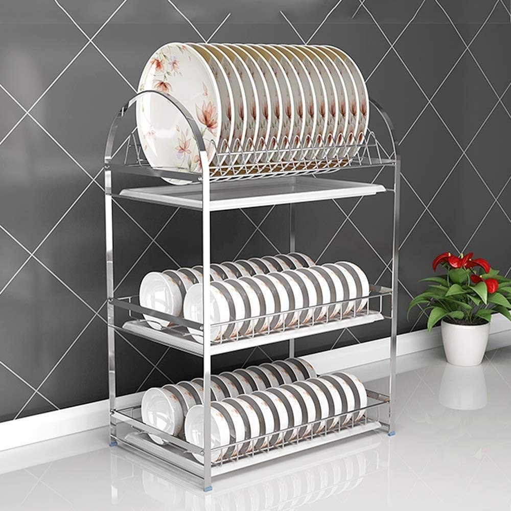 Étagère de cuisine en inox contre le désordre des épices et des assiettes