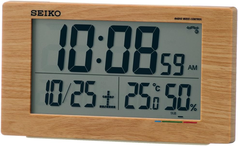 Seiko SQ784A Digital Alarm Clock, front view with dimensions and features: Radio Clock, Electronic Sound, Snooze, Light, Full Auto Calendar, Temperature, Humidity, Low Battery Warning, 2 AA Alkaline Batteries, Body Weight 220g.