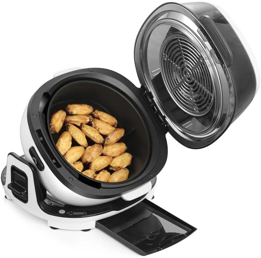 Open air fryer oven with chicken wings inside