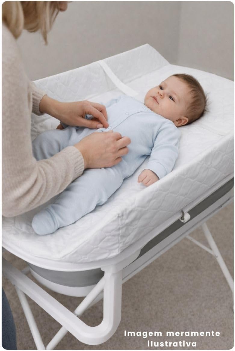 Adult changing a baby on the changing table