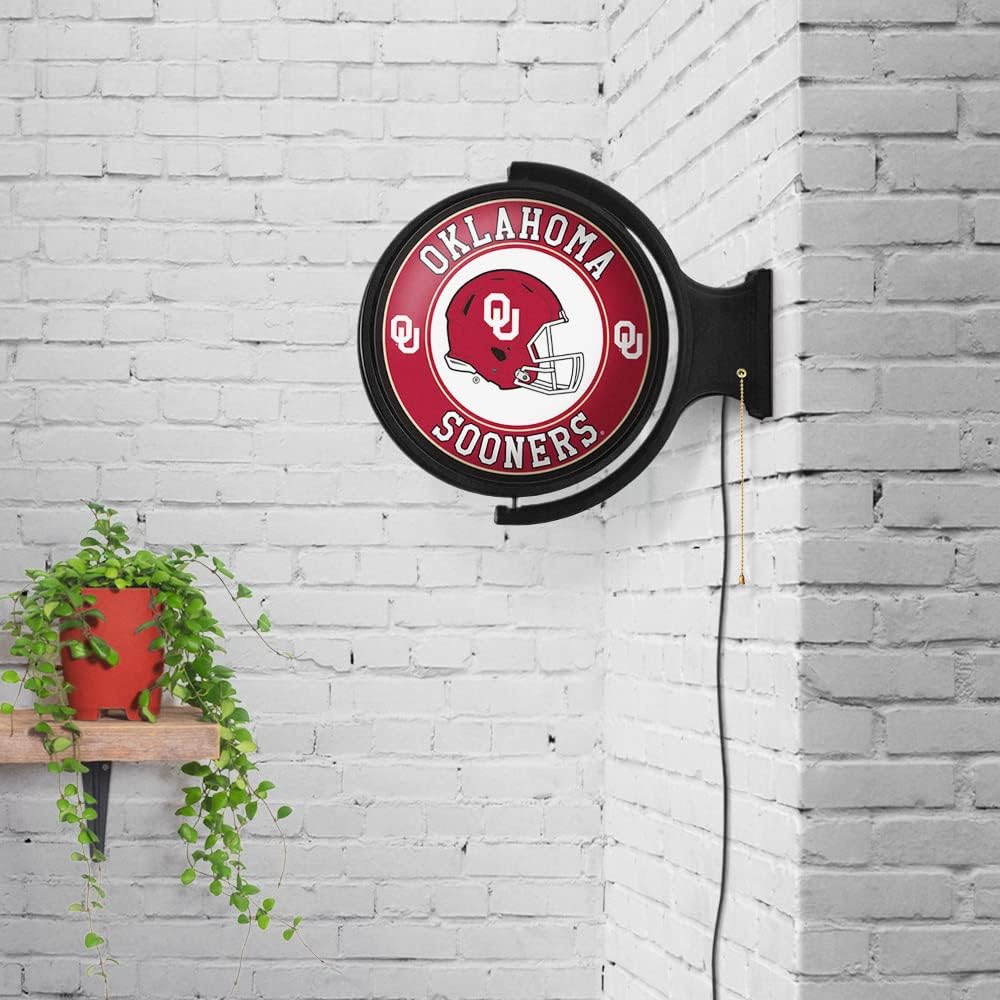 The Fan Brands NCAA Oklahoma Sooners: Helmet - Original Round Rotating Lighted Wall Sign - Football, Basketball & Baseball Wall Decor - College Sports Décor for Home, Office, Game Room, Fan Cave & Garage - USA Made