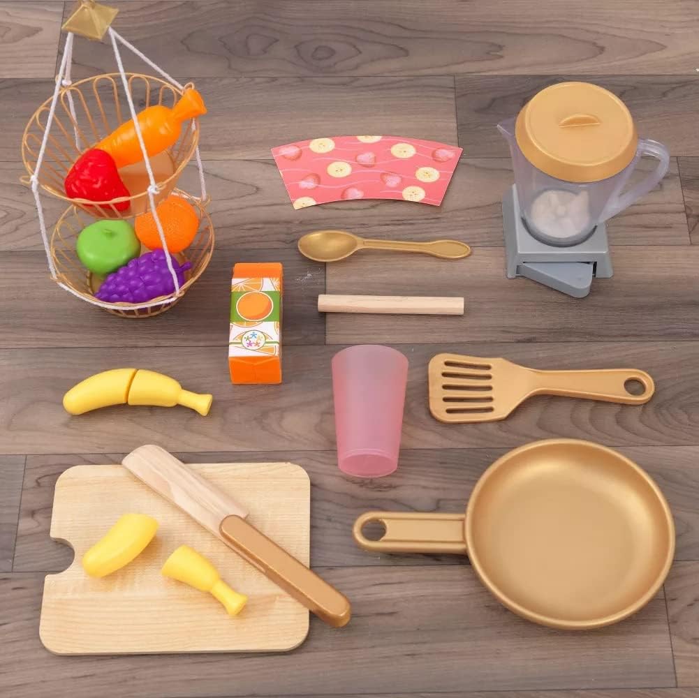 All 22 accessories for the KidKraft Smoothie Fun Play Kitchen laid out on a wooden floor.