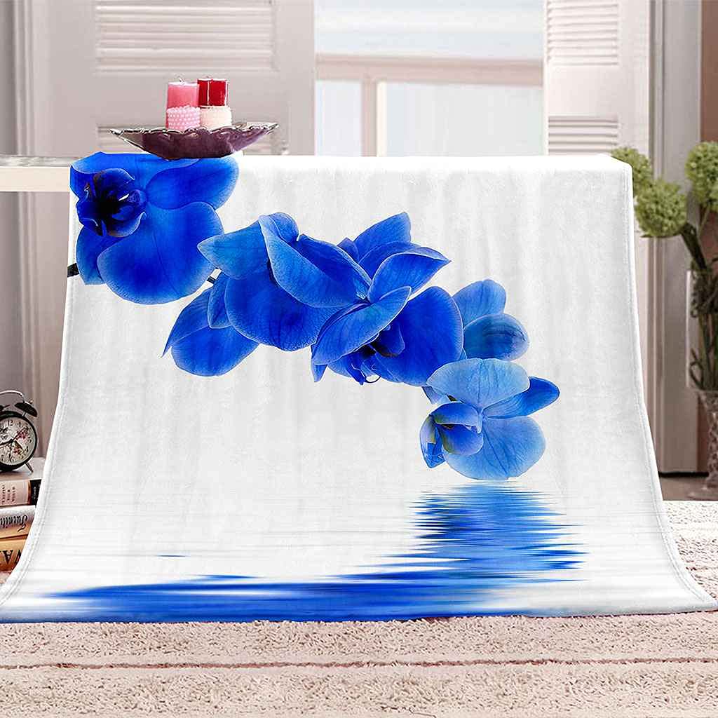 Couverture fleur bleue en microfibre pour vos soirées canapé