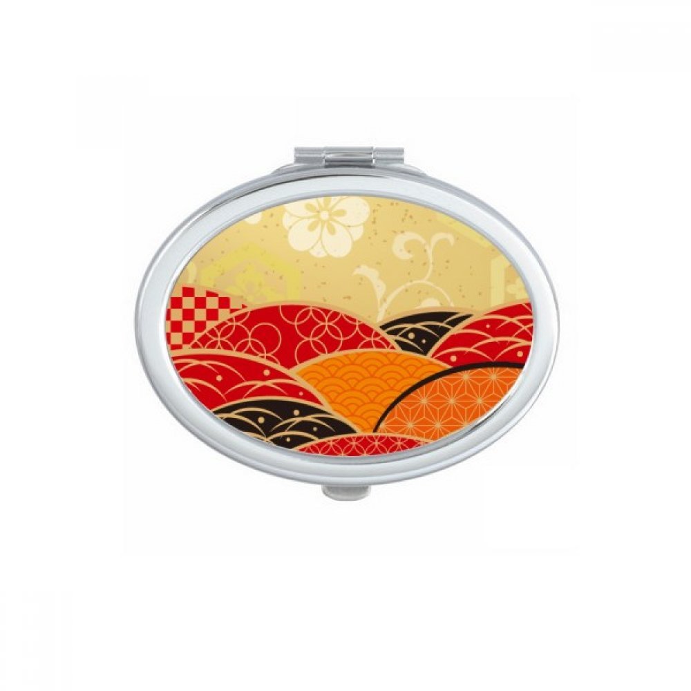 Miroir de maquillage ovale géométrie rouge noir pour vos retouches en terrasse de café