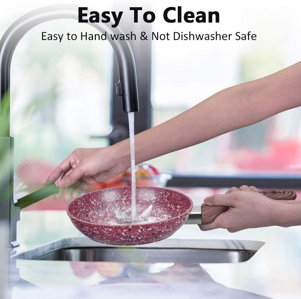 Red Frying Pan Being Washed in Sink