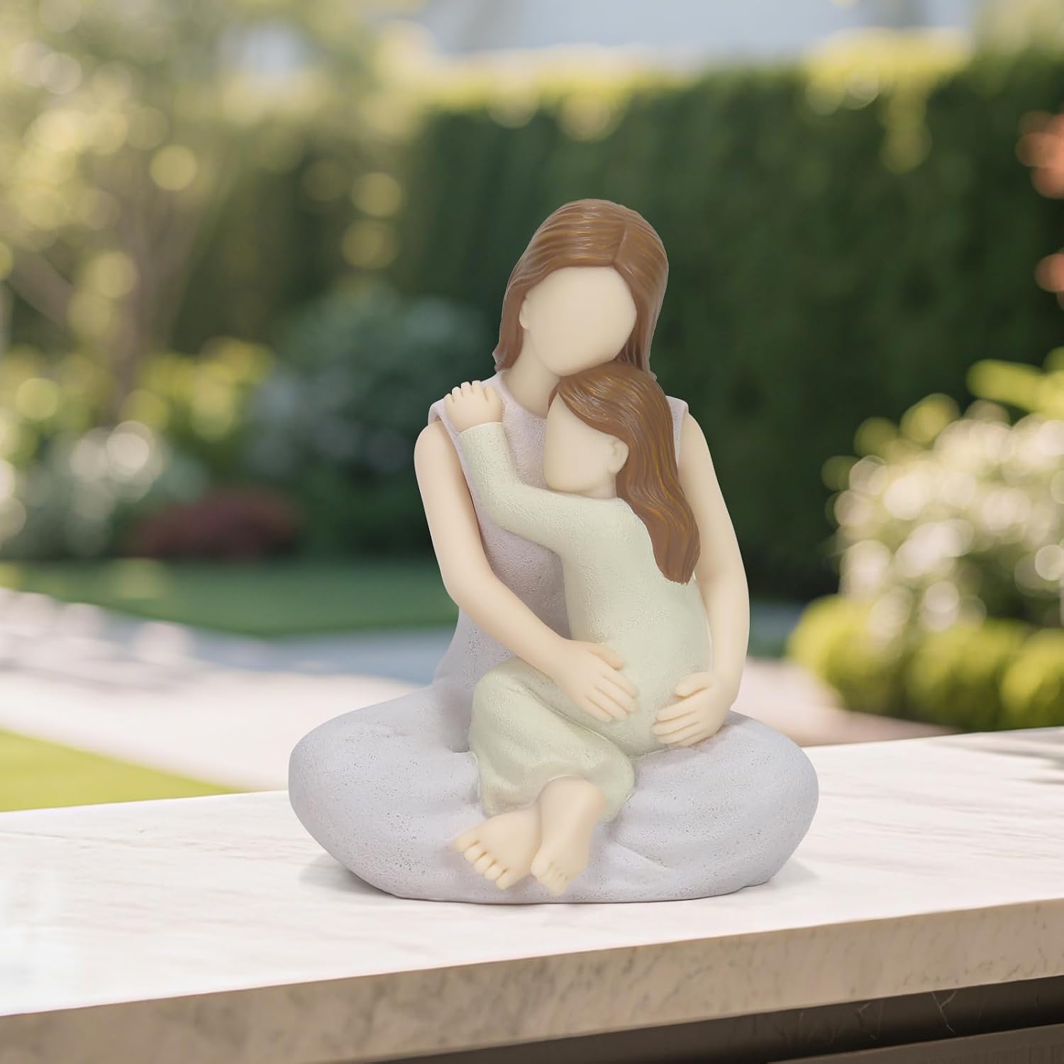 Figurine of Mother Embracing Daughter: A Touching Expression of Maternal Affection