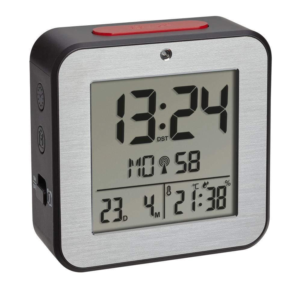 Front view of the TFA Dostmann Digital Radio-Controlled Alarm Clock 60.2547.54 showing the digital display with time, date, day, temperature, and humidity.