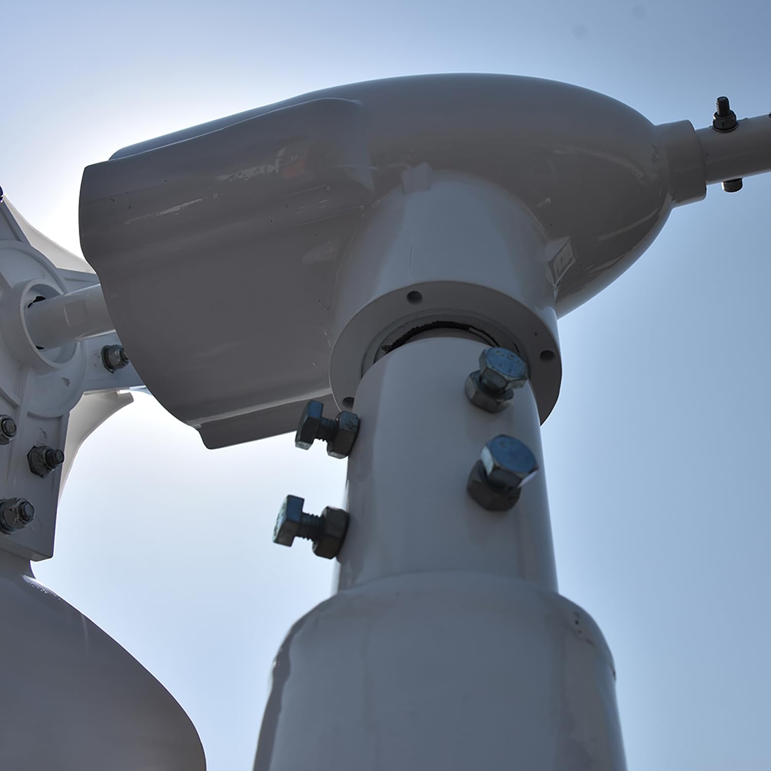 Close-up of the wind turbine base connection to the mounting pole