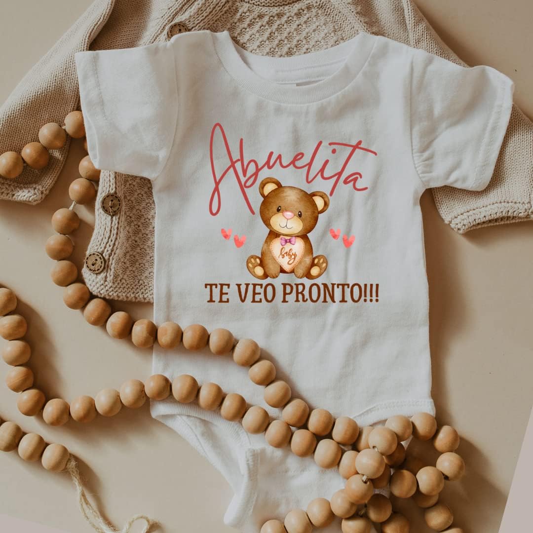 Hola Abuela Grandma Baby Announcement Onesie In Spanish, Cute Pregnancy Announcement Gifts For Grandparents, Surprise Baby Reveal Ideas For Abuelita To Be.