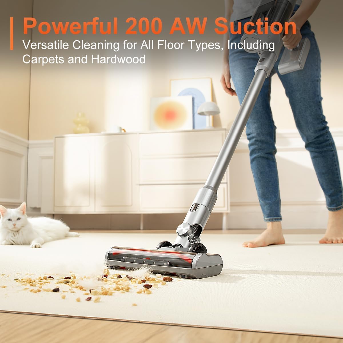Person vacuuming a carpet with the uwant V100, showing debris being picked up