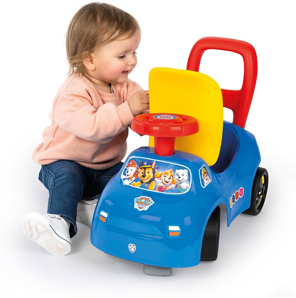 Child interacting with the Smoby Paw Patrol Ride-On steering wheel