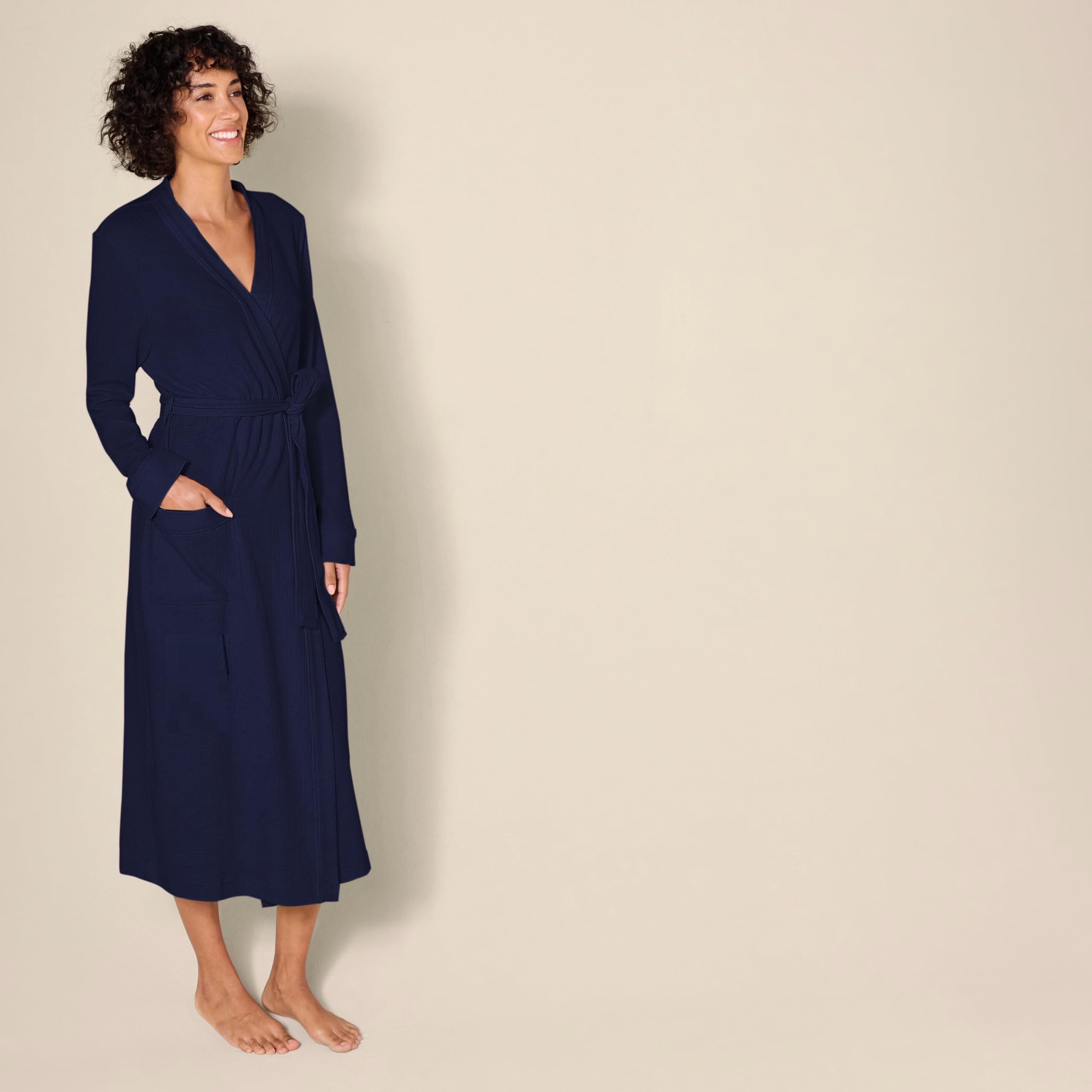 A close-up shot showcasing the texture of the lightweight waffle knit fabric on the Amazon Essentials women's robe.