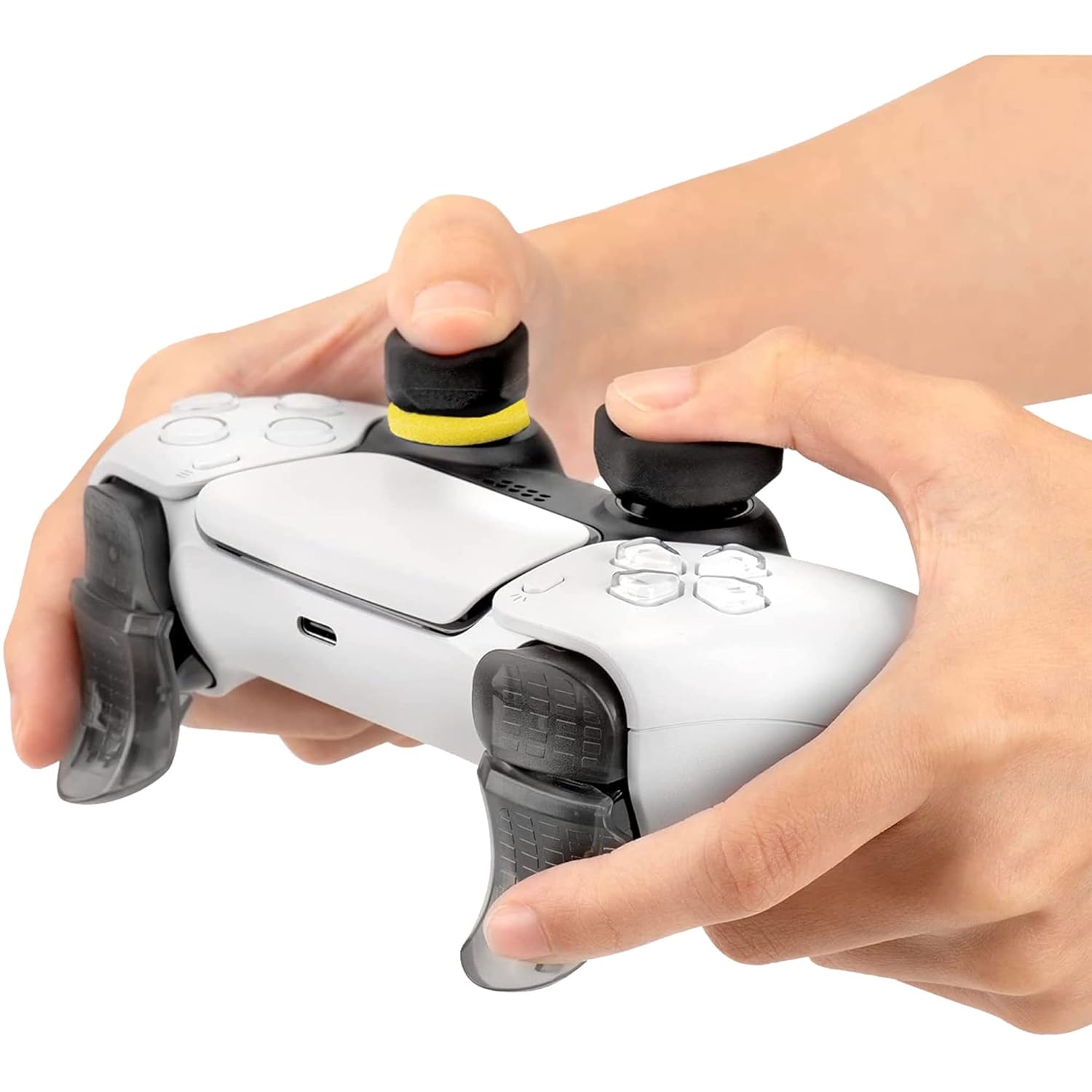 Hands on a PS5 controller with Subsonic accessories, showing thumb placement on grips