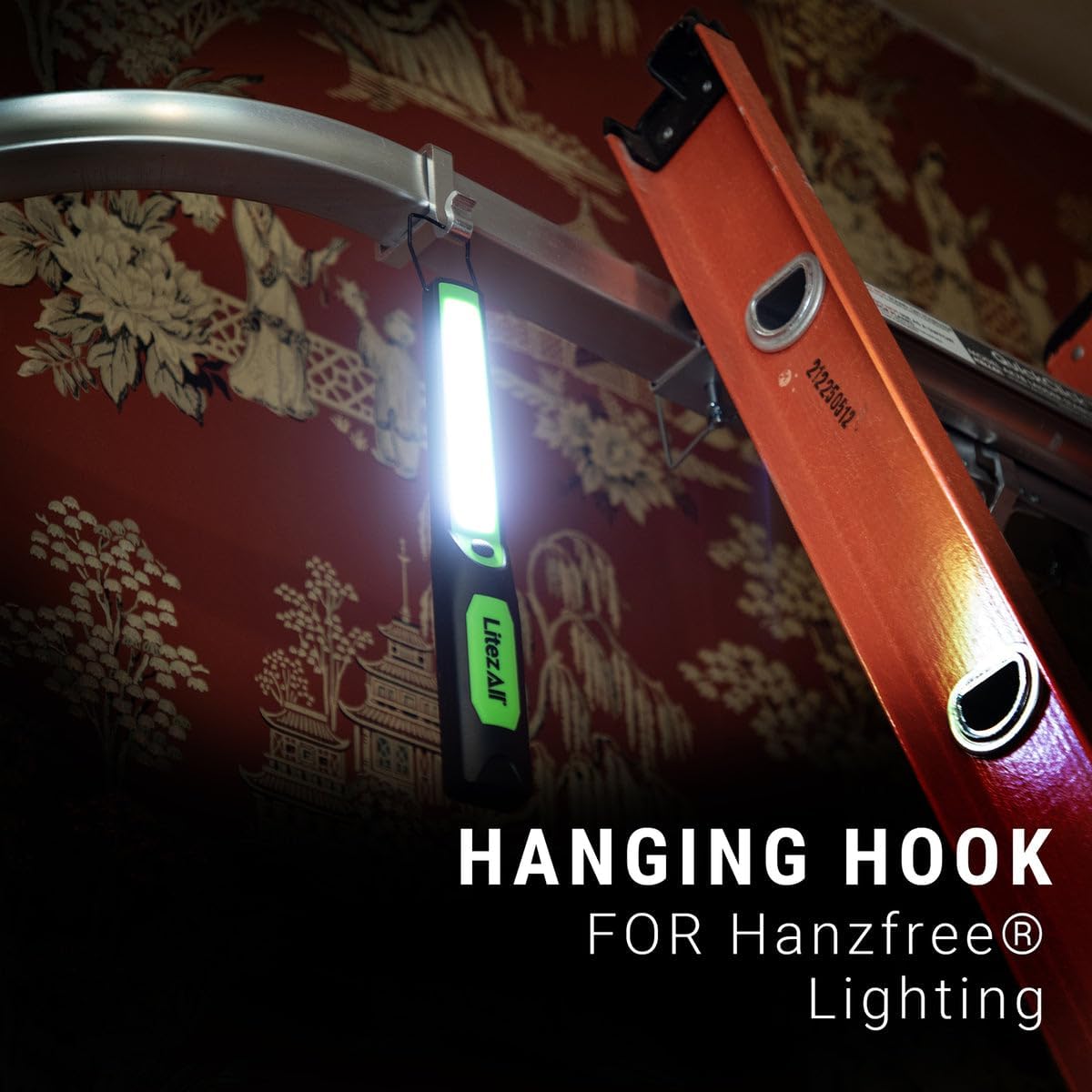 LitezAll Wand Work Light hanging from a garage door rail using its integrated hook.