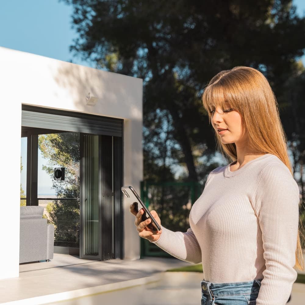 Woman controlling Cecotec Conga Windroid 1290 DoubleSpray Connected T. robot with smartphone app