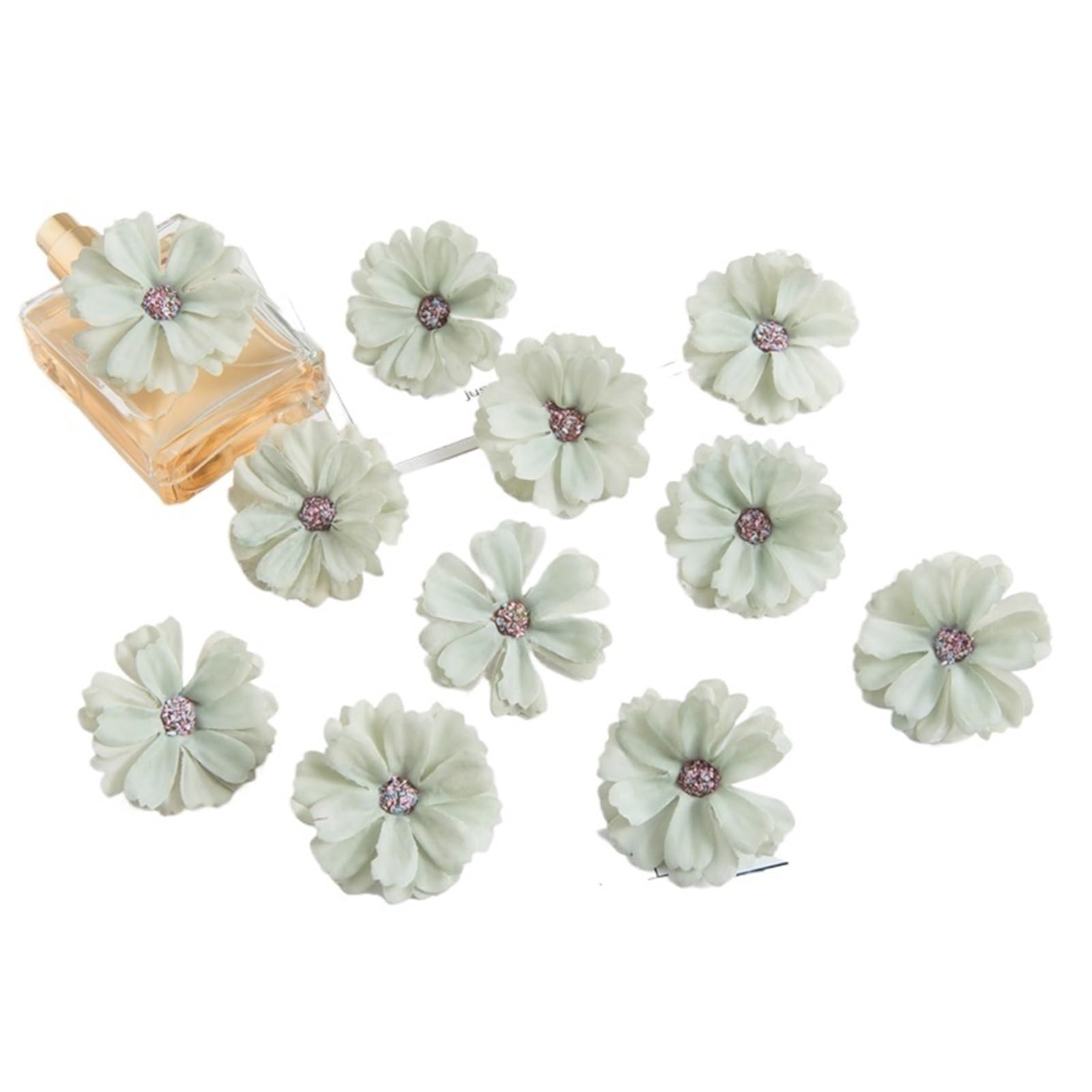 Fleurs artificielles roses de noël pour créer une couronne de fête et coiffure de mariée
