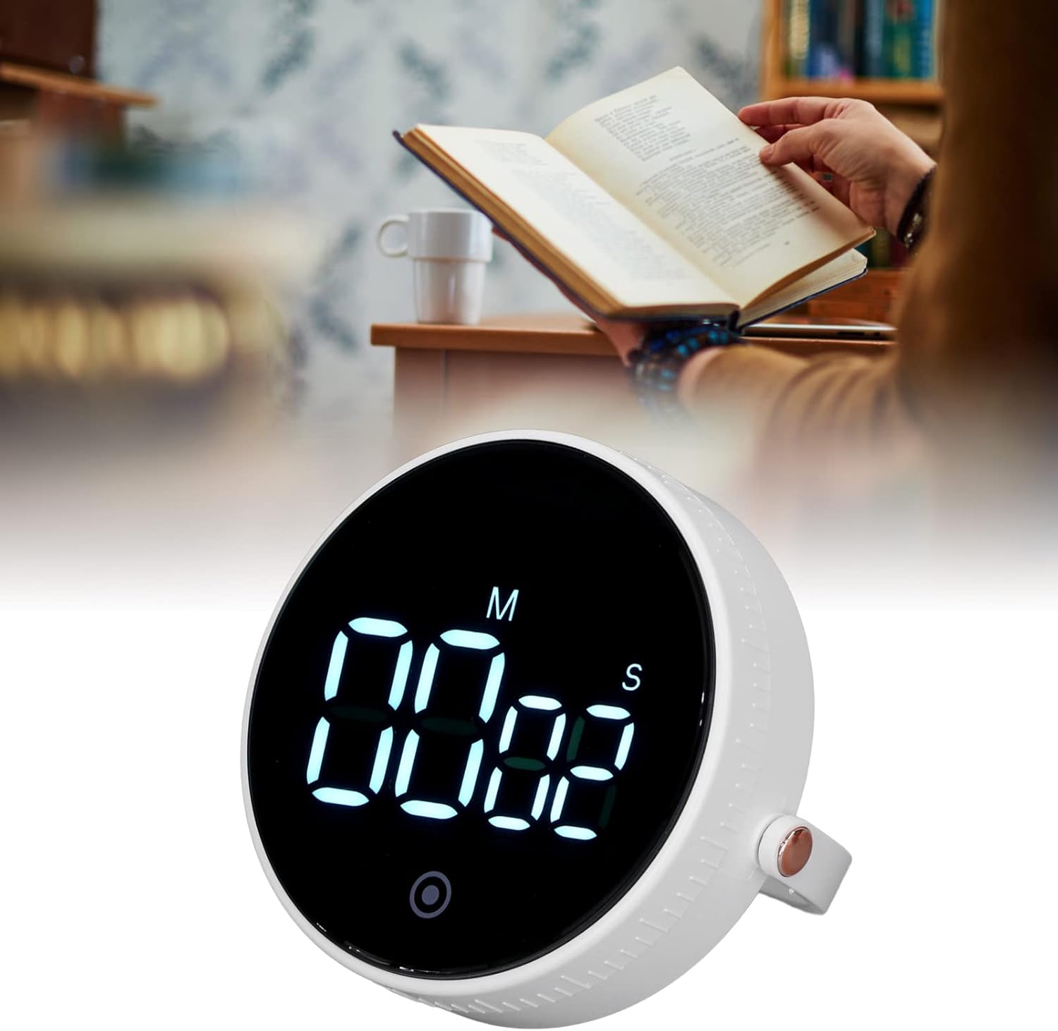 The YOUTHINK Electronic Timer placed on a desk next to a person reading a book, demonstrating its use in a study environment.