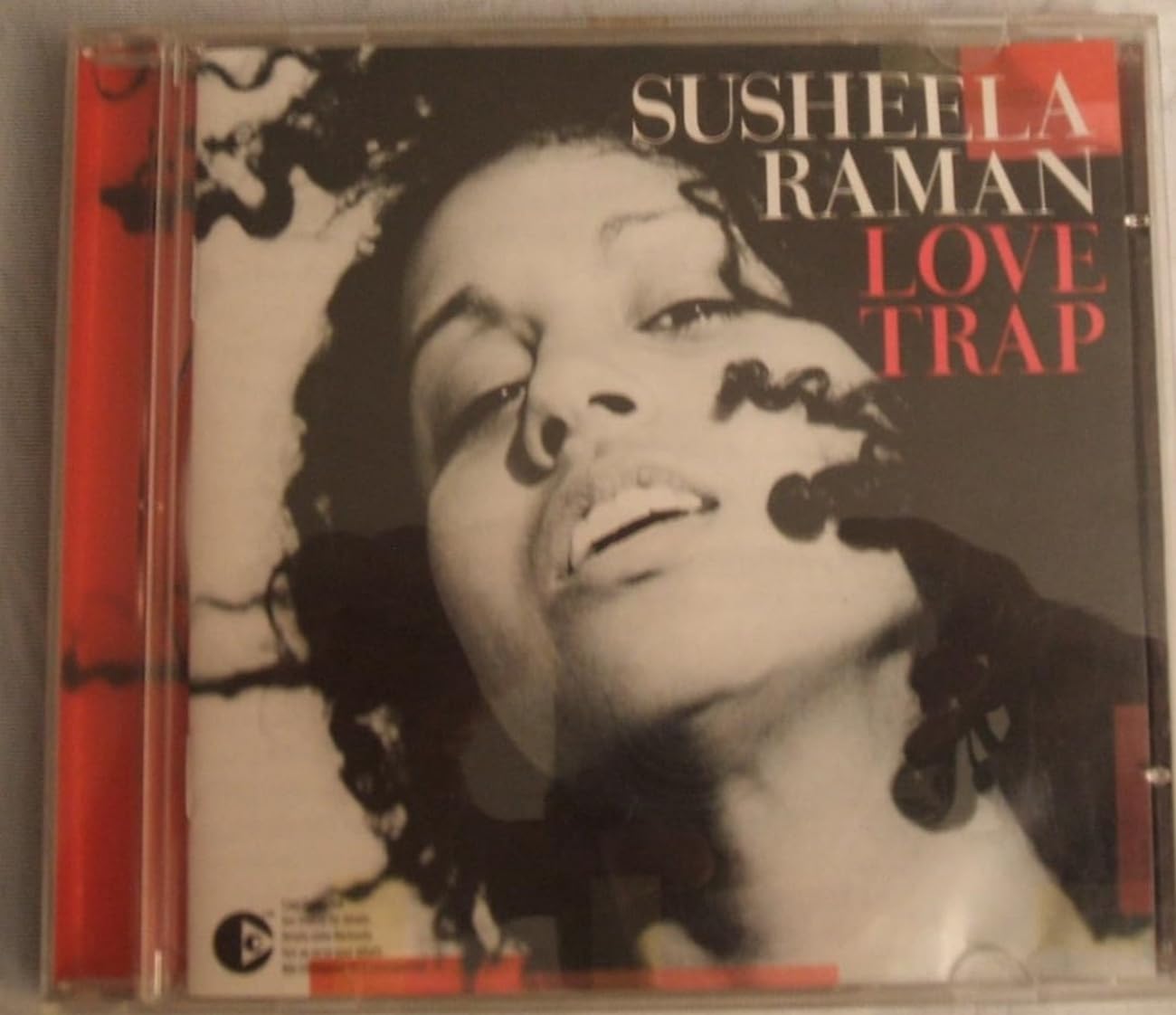 Love Trap [Audio CD] Susheela Raman; Aref Durvesh; Sandhya Sanjana; Hilaire Penda; Djanuno Dabo and Tony Allen