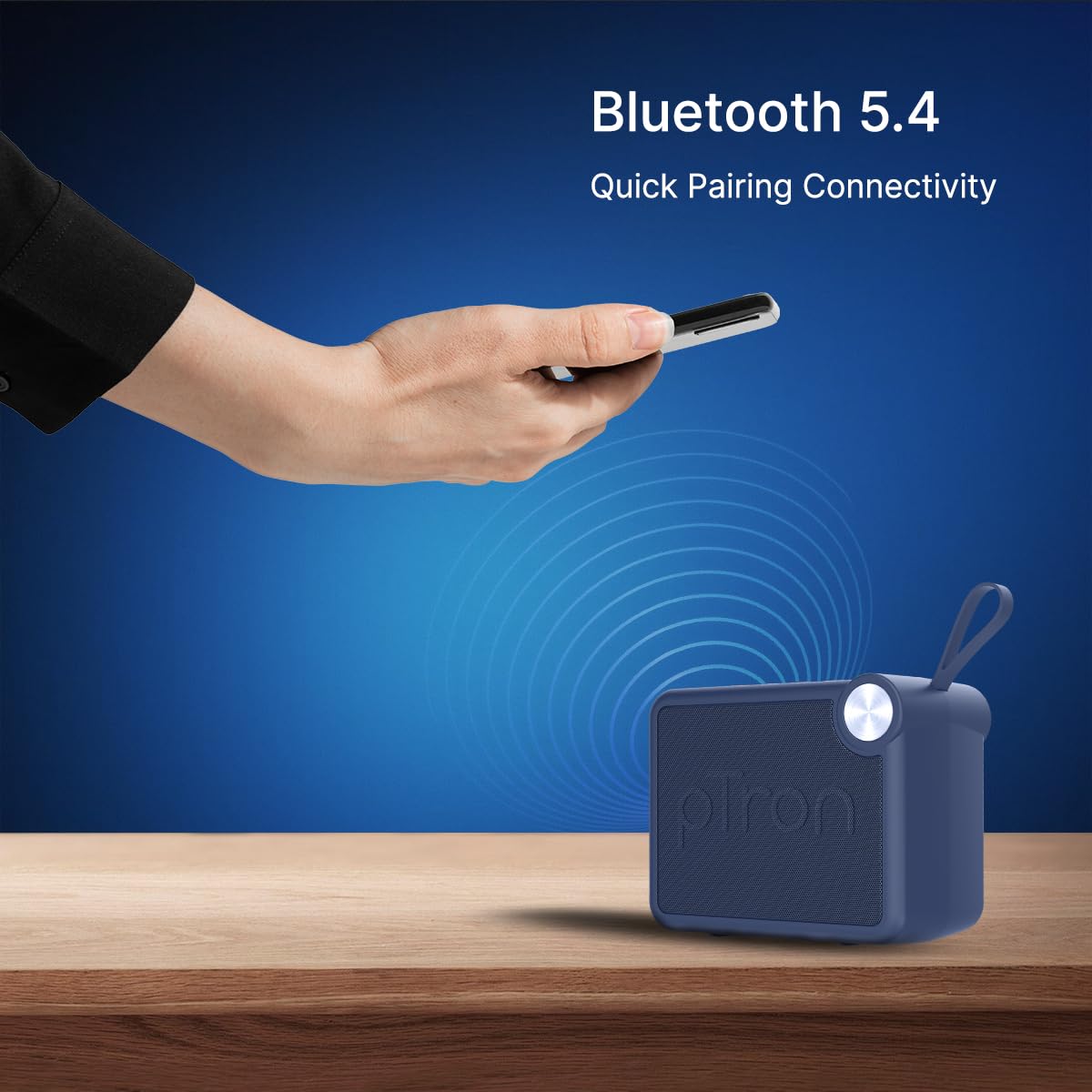 A hand holding a smartphone connecting via Bluetooth 5.4 to the pTron Funk Rap speaker.