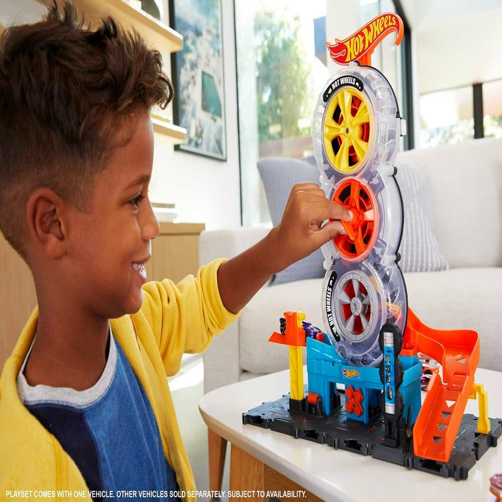 Hot Wheels City Super Twist Tire Shop - Taller con Rueda Gigante - Incluye Coche - Compatible con Conjuntos Hot Wheels - Regalo para Niños de 4-8 Años, HDP02