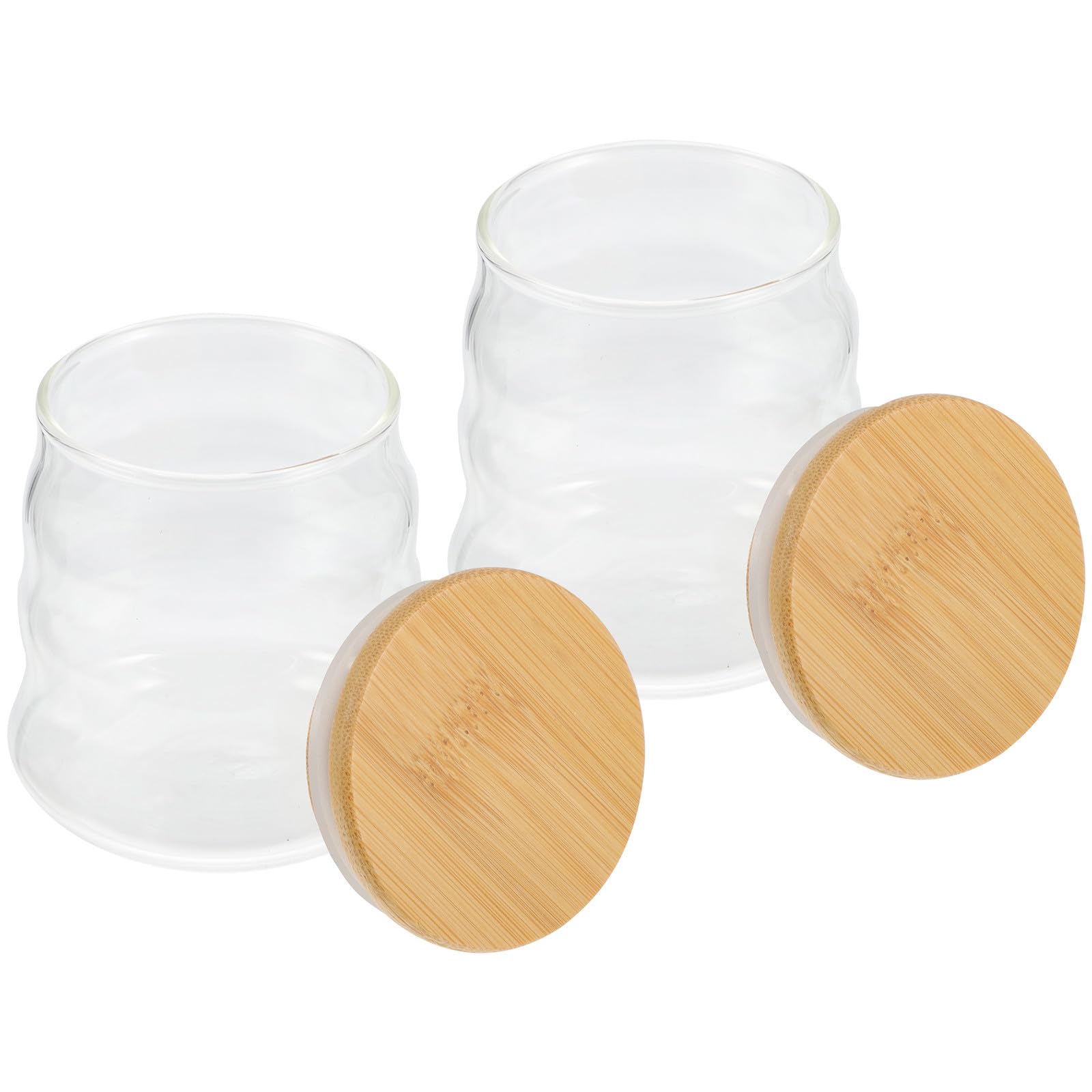 Frascos de vidrio pequeños con diseño a prueba de humedad para conservar té y frutos secos frescos.