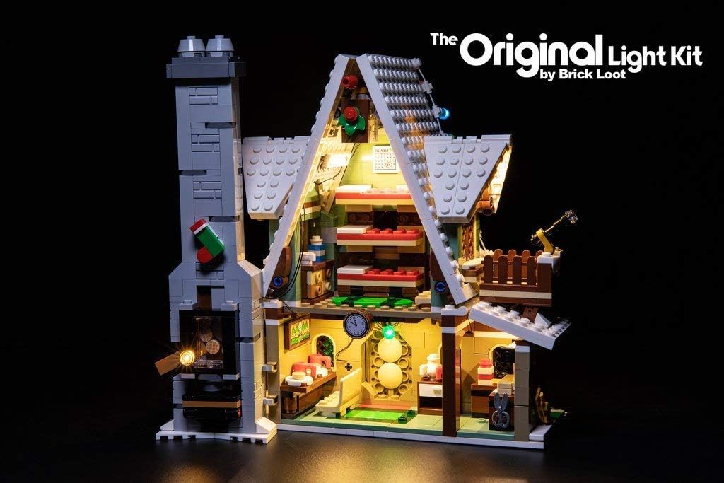 An interior view of the illuminated LEGO Elf Club House Set 10275, showing lights within the rooms and on the Christmas tree.