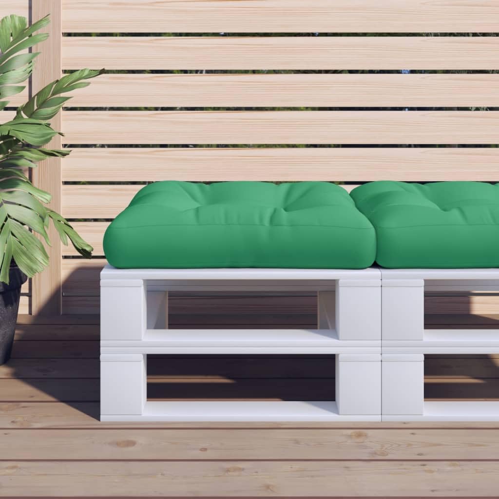 Coussin pour palette vert fini les fesses rouges sur la terrasse