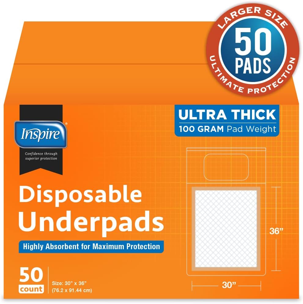 Boston Terrier dog sitting on an Inspire bed pad