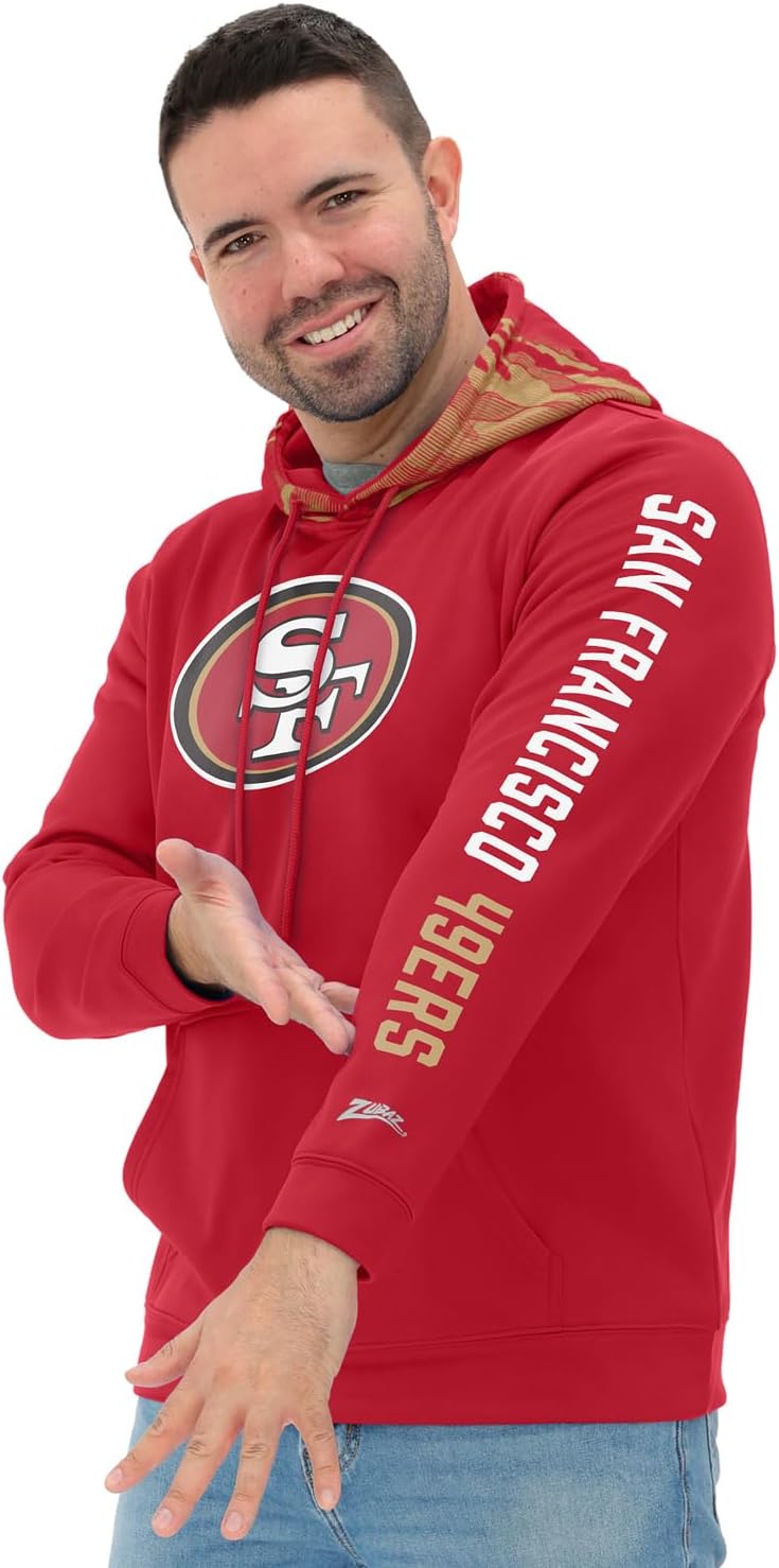 Zubaz NFL Football Men's Solid Team Hoodie with Camo Lined Hood and Sleeve Graphic (Small - 5X-Large)