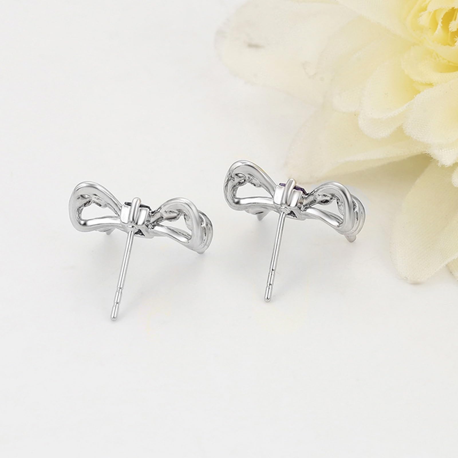 Elegante Ohrstecker mit Schleife und Amethyst