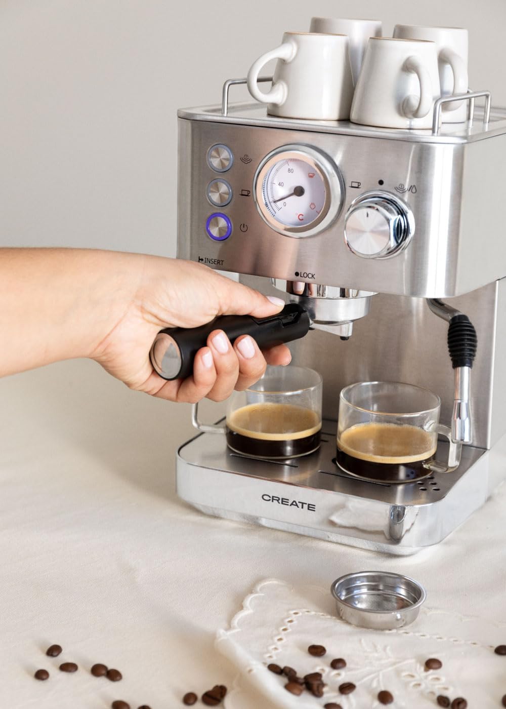 Hand inserting portafilter into the espresso machine group head