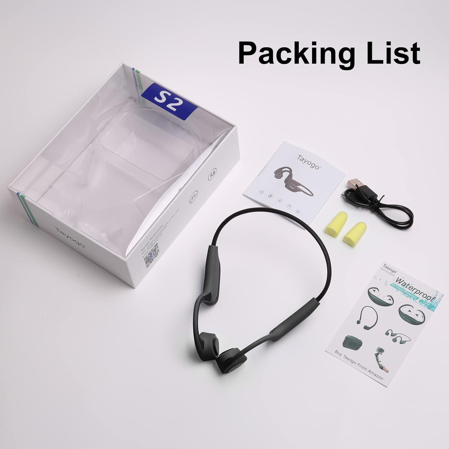 Contents of the Tayogo S2 headphone package including headphones, charging cable, earplugs, and manual.