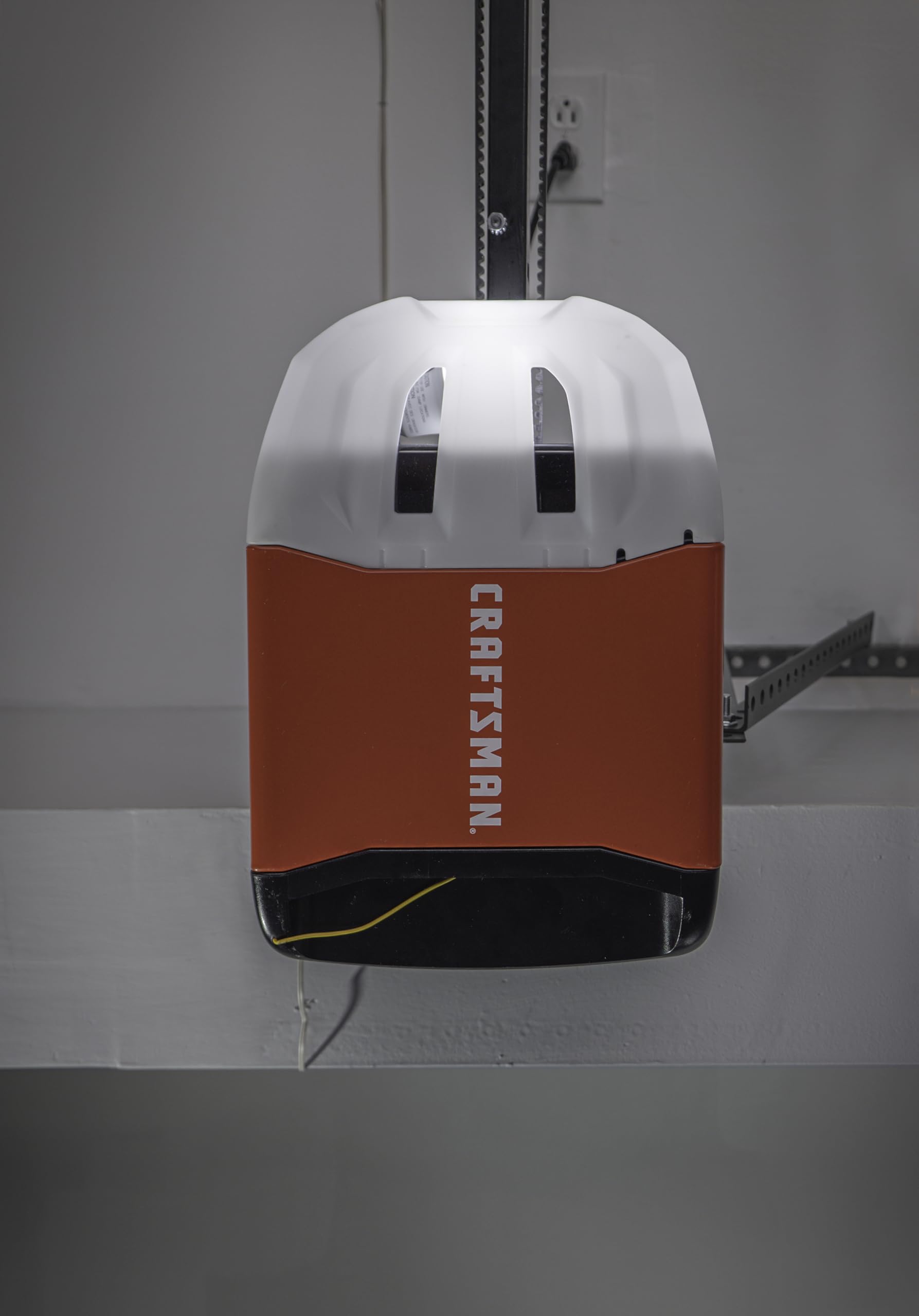 Side view of CRAFTSMAN garage door opener installed in a garage