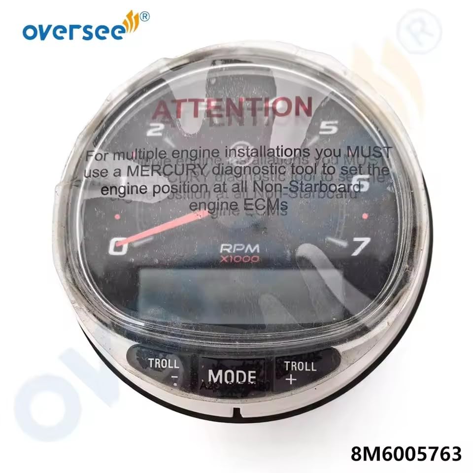 Voorkant view of the SmartCraft SC-1000 Tachometer with an 'ATTENTION' sticker warning about using a Mercury diagnostic tool for multiple engine installations.