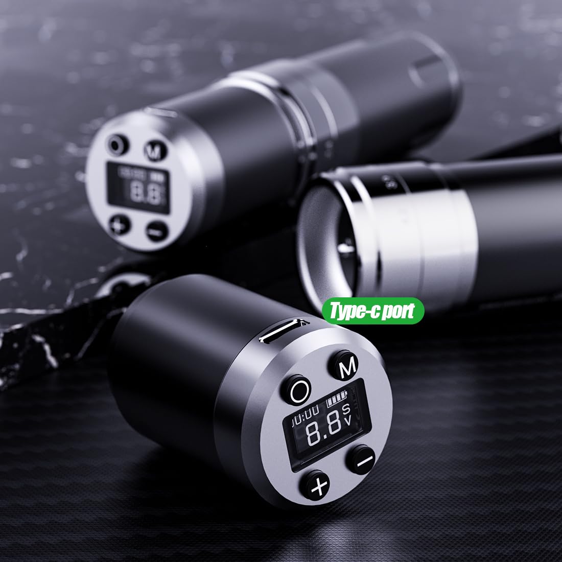 Close-up of the Dragonhawk tattoo machine's Type-C charging port and control panel.