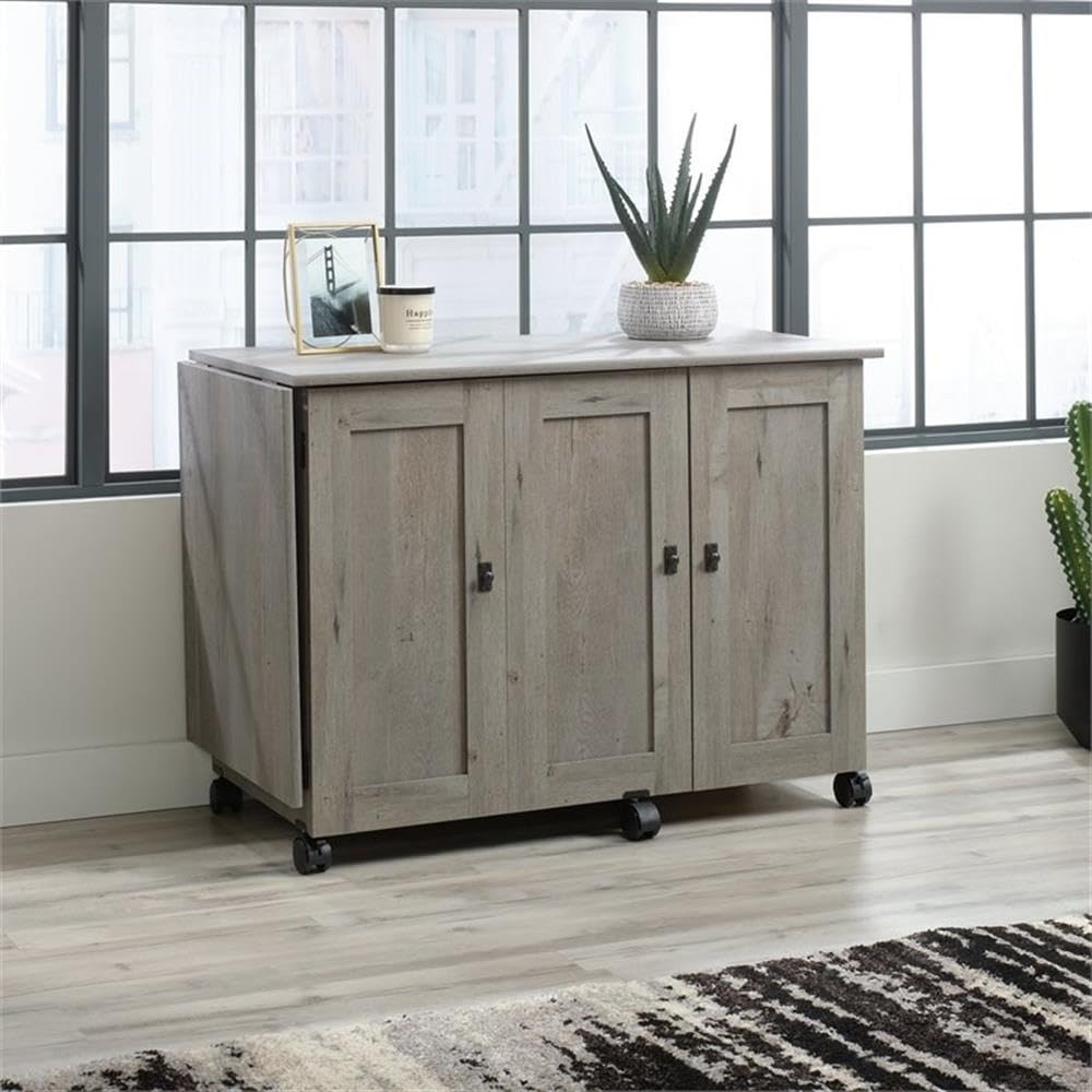 BOWERY HILL Contemporary Engineered Wood Sewing Craft Table with 2 Doors, 2 Storage Bins, Hidden Shelf, 2 Adjustable Shelves, Easy-Roll Casters, in Mystic Oak Finish