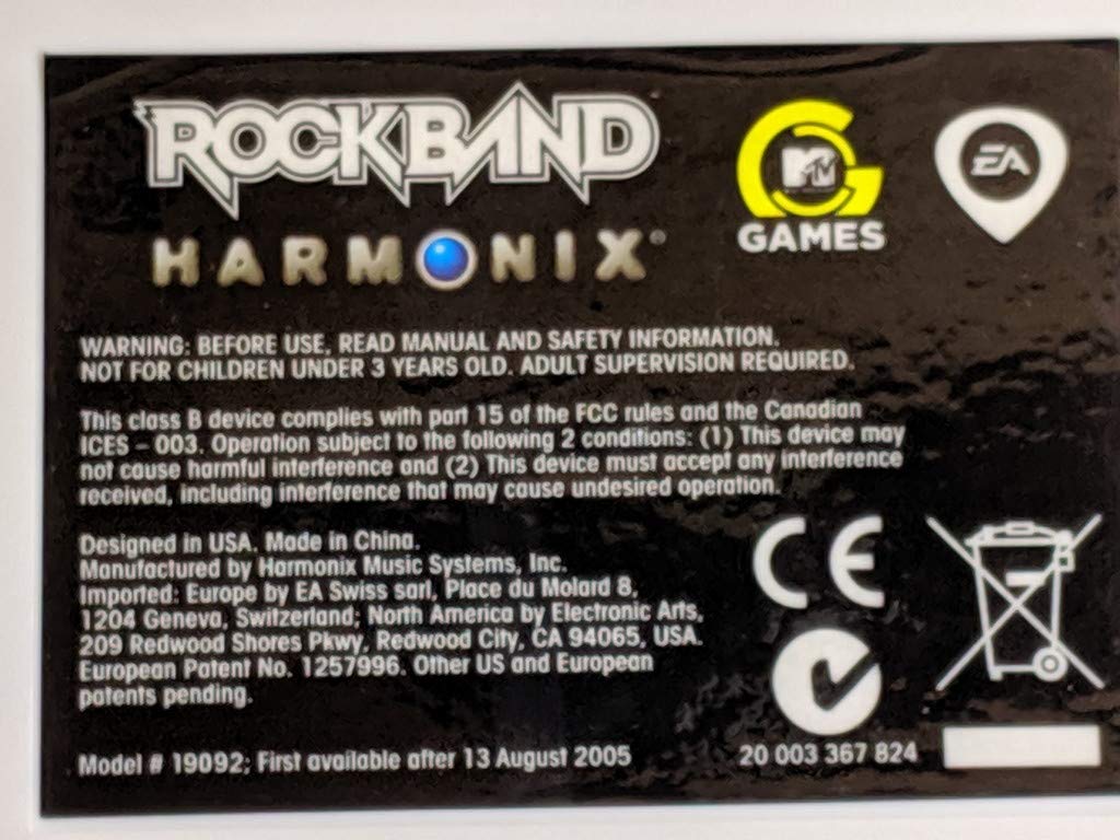 Top view of the Harmonix Rock Band drum pads, showing yellow and blue pads with gray playing surfaces.